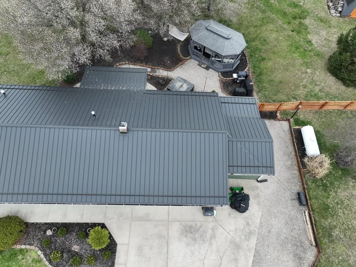 Charcoal standing-seam metal roof shown from above
